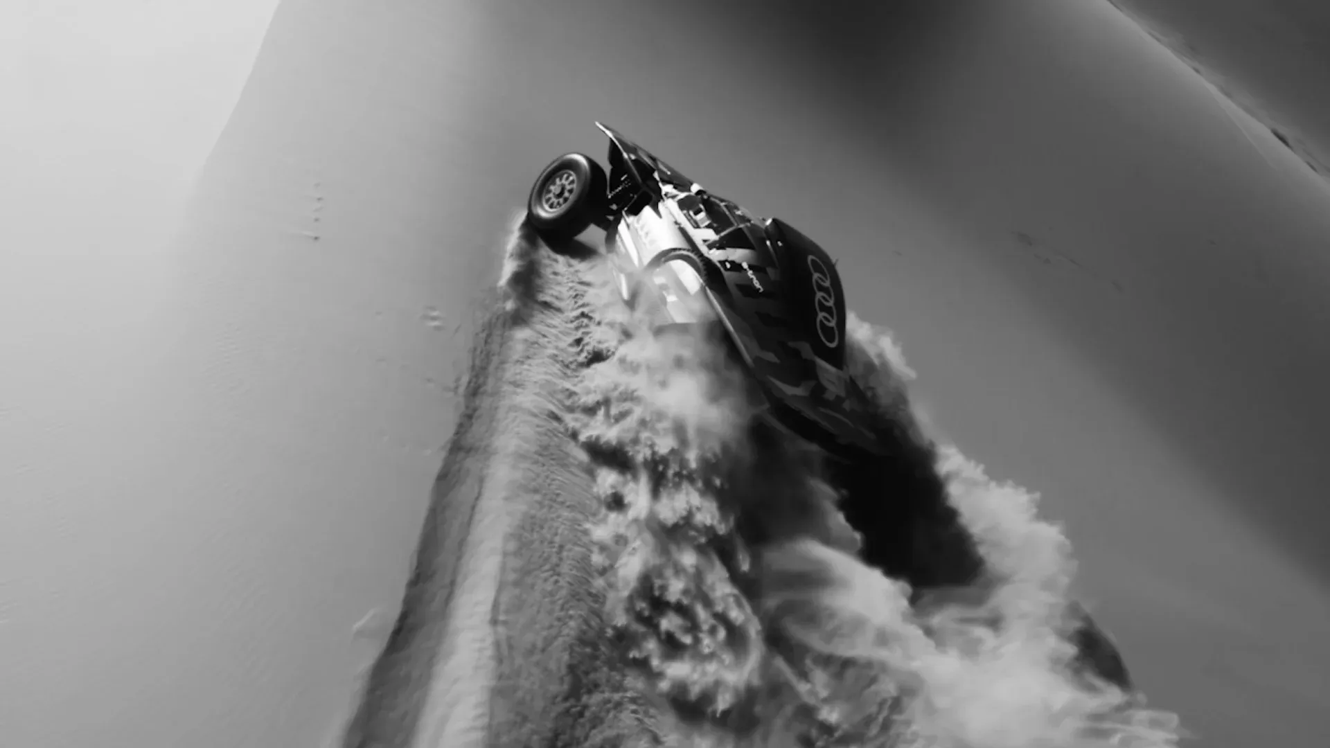 audi rally race car racing a sand dune in the 2020s