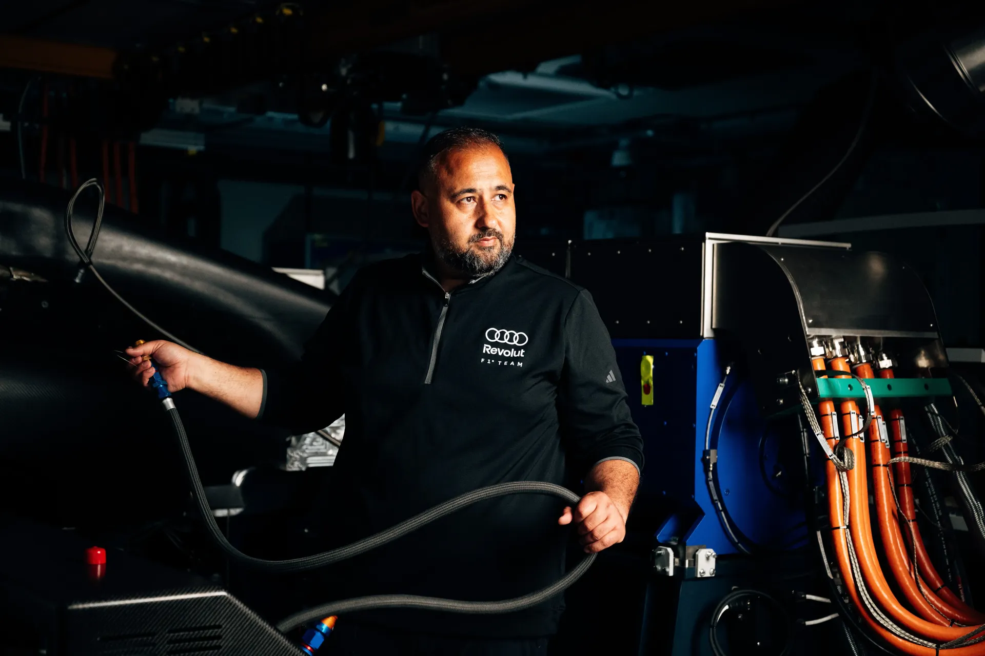 Hakan working on the powertrain test setup, managing connections between components that bring the engine, energy recovery system, and gearbox together.
