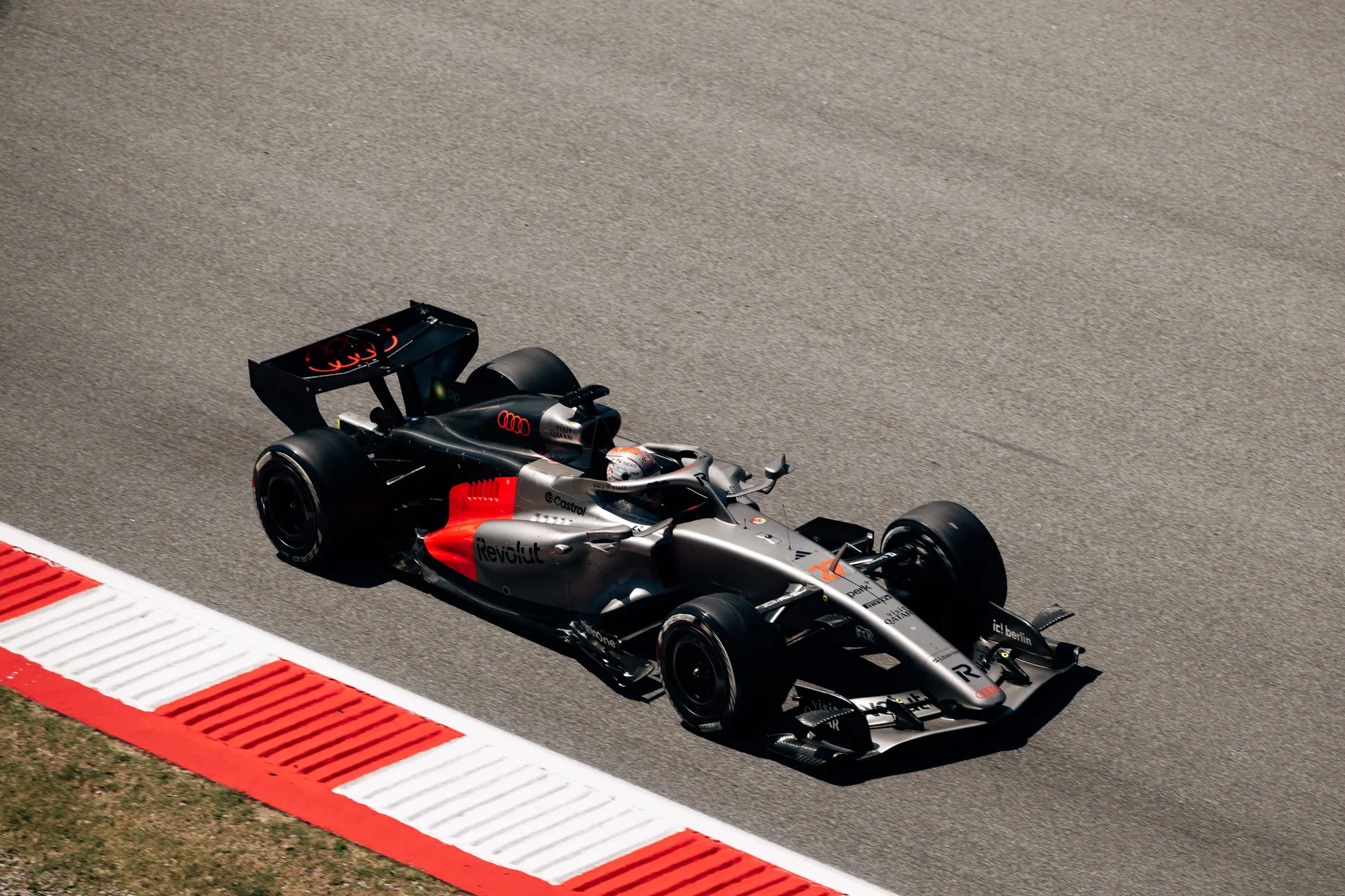 Audi R26 driven by Nico Hulkenberg at speed through a corner during the Barcelona race weekend.