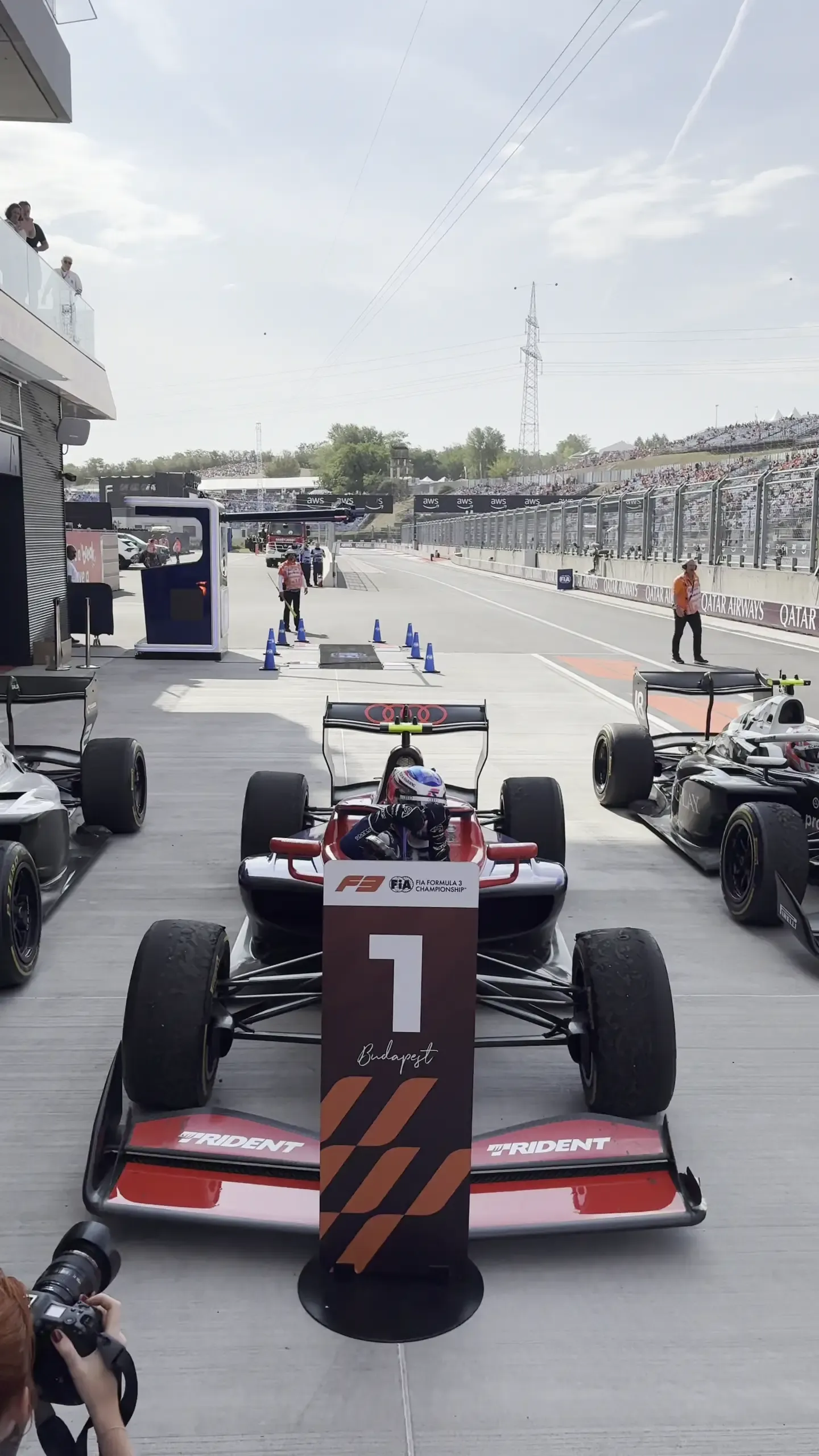 Audi Revolut F1® Team Academy driver Freddie Slater celebrates on top of his car after winning the FIA Formula 3 race at the Hungaroring.