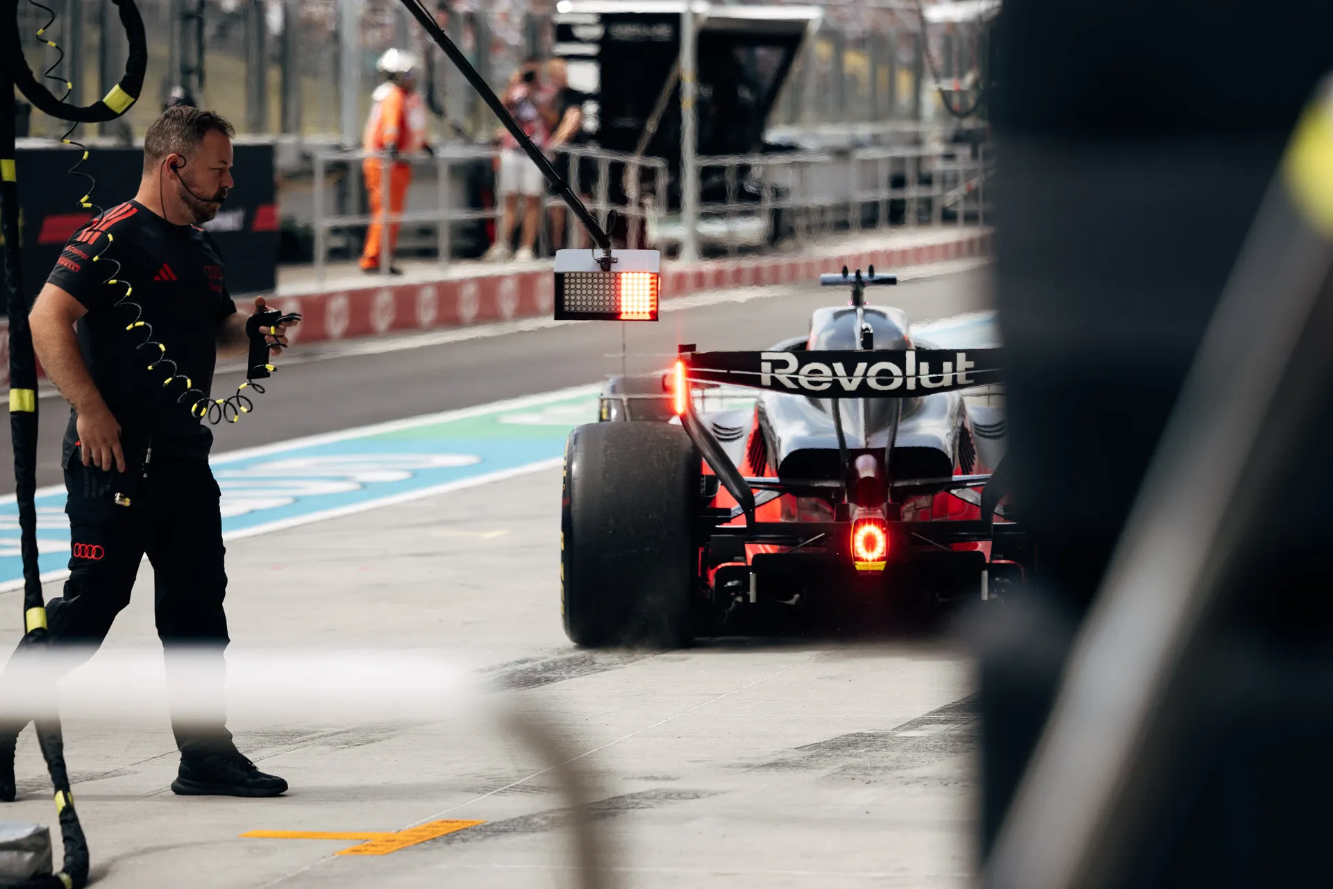 The Audi R26 drives through the Hungaroring pit lane during FP1.