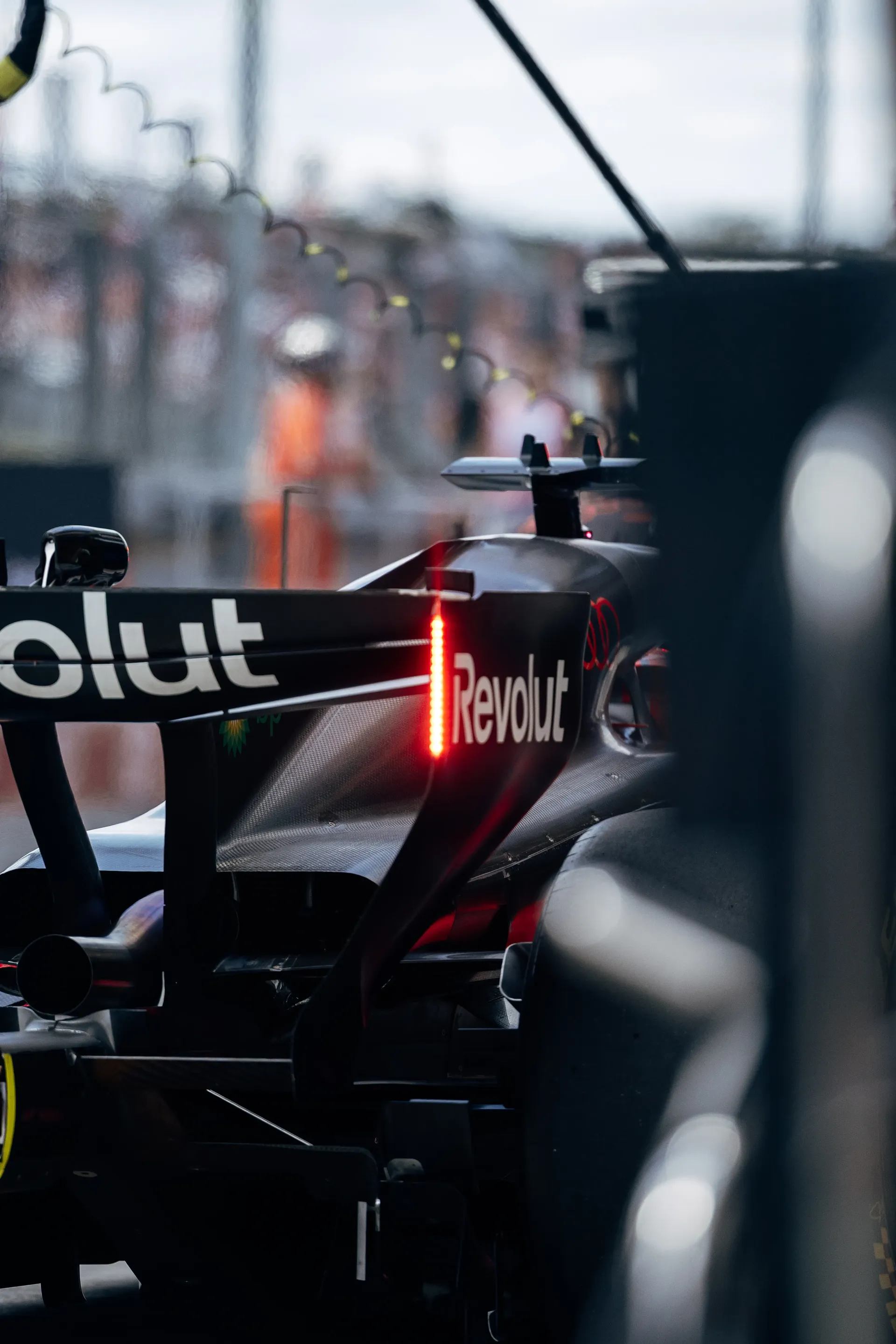 Rear view of the Audi R26 leaving the garage during Friday practice.