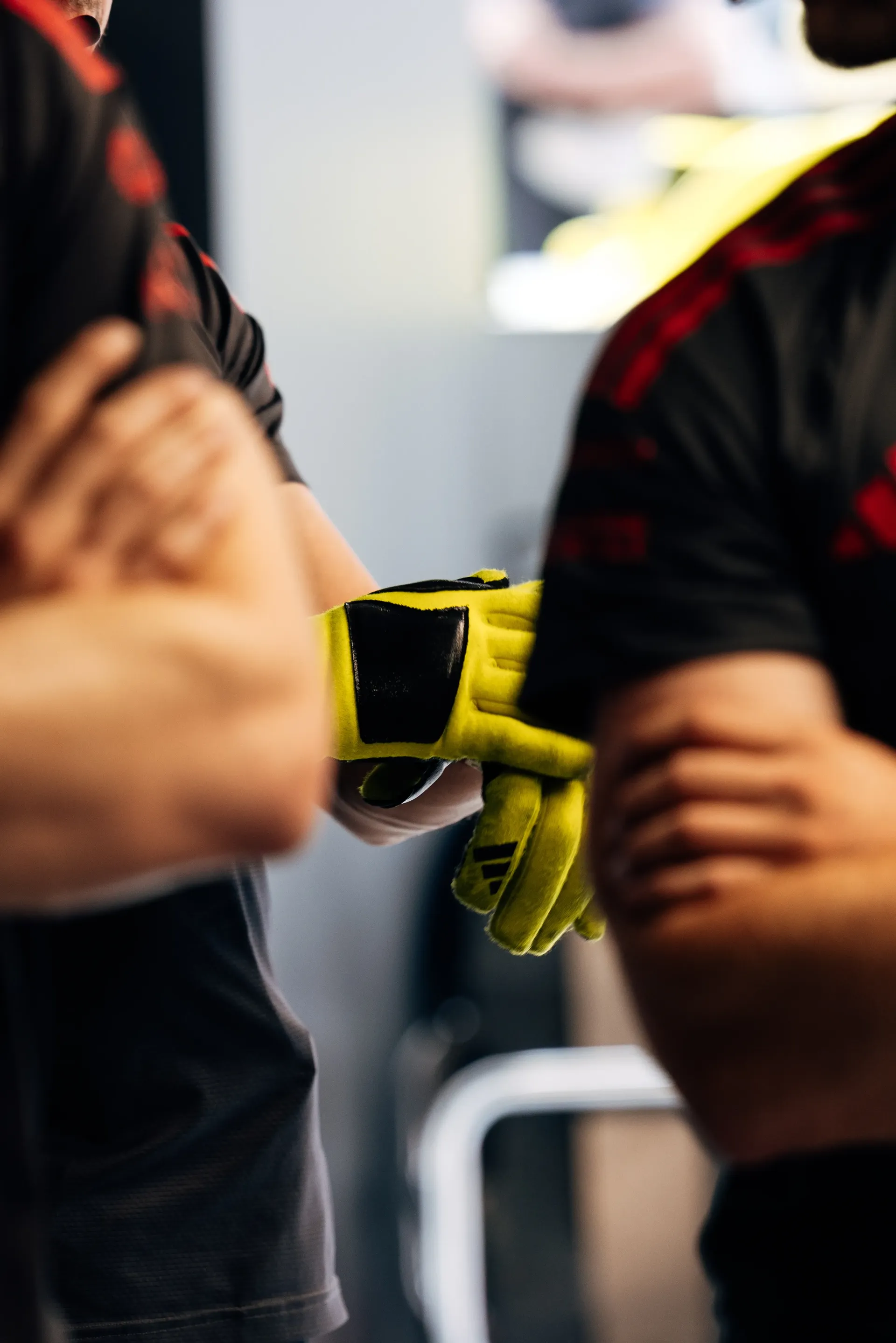 Close-up of Audi Revolut F1® Team mechanics preparing equipment in the garage.