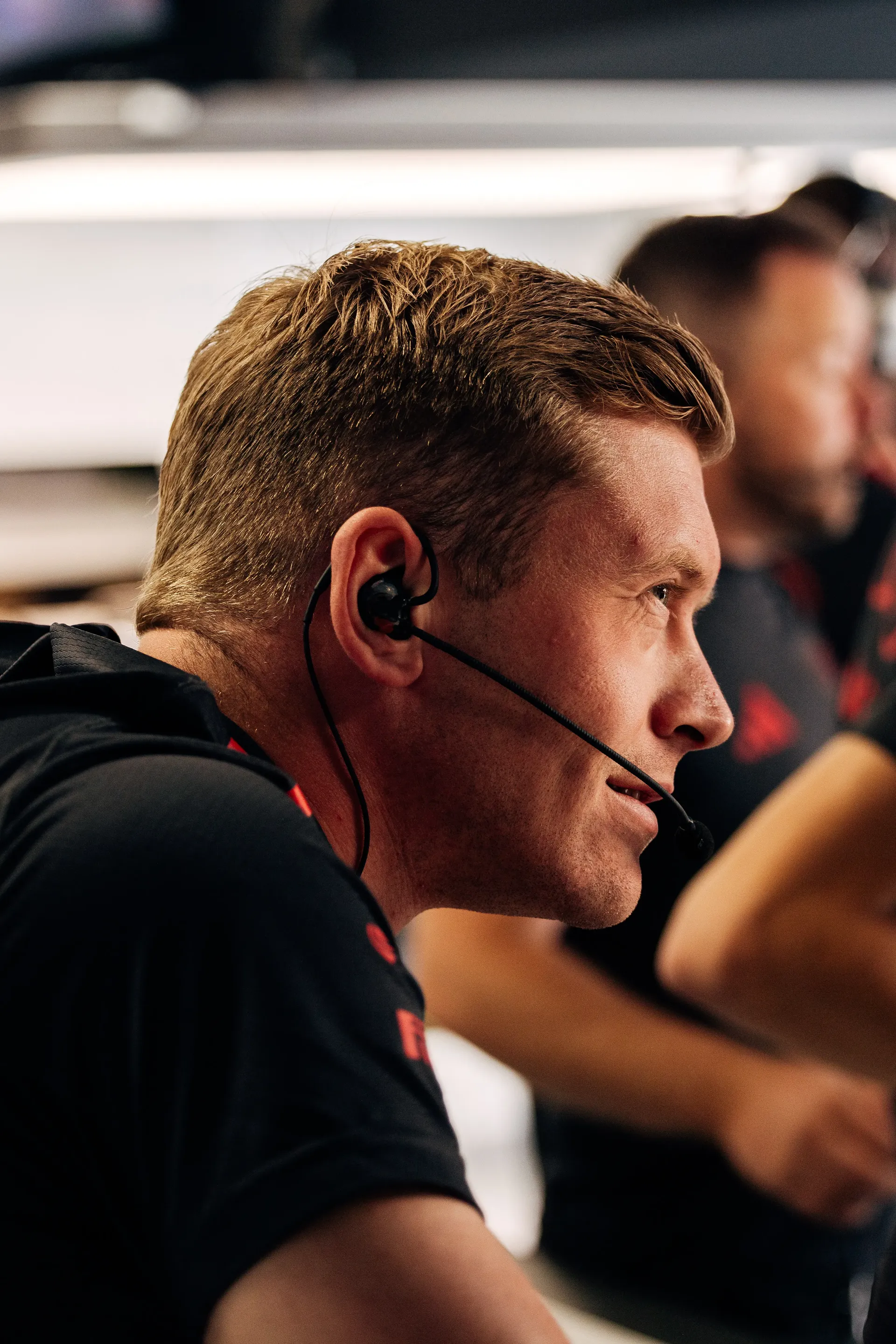 Audi Revolut F1® Team engineer monitors the session from the pit wall.