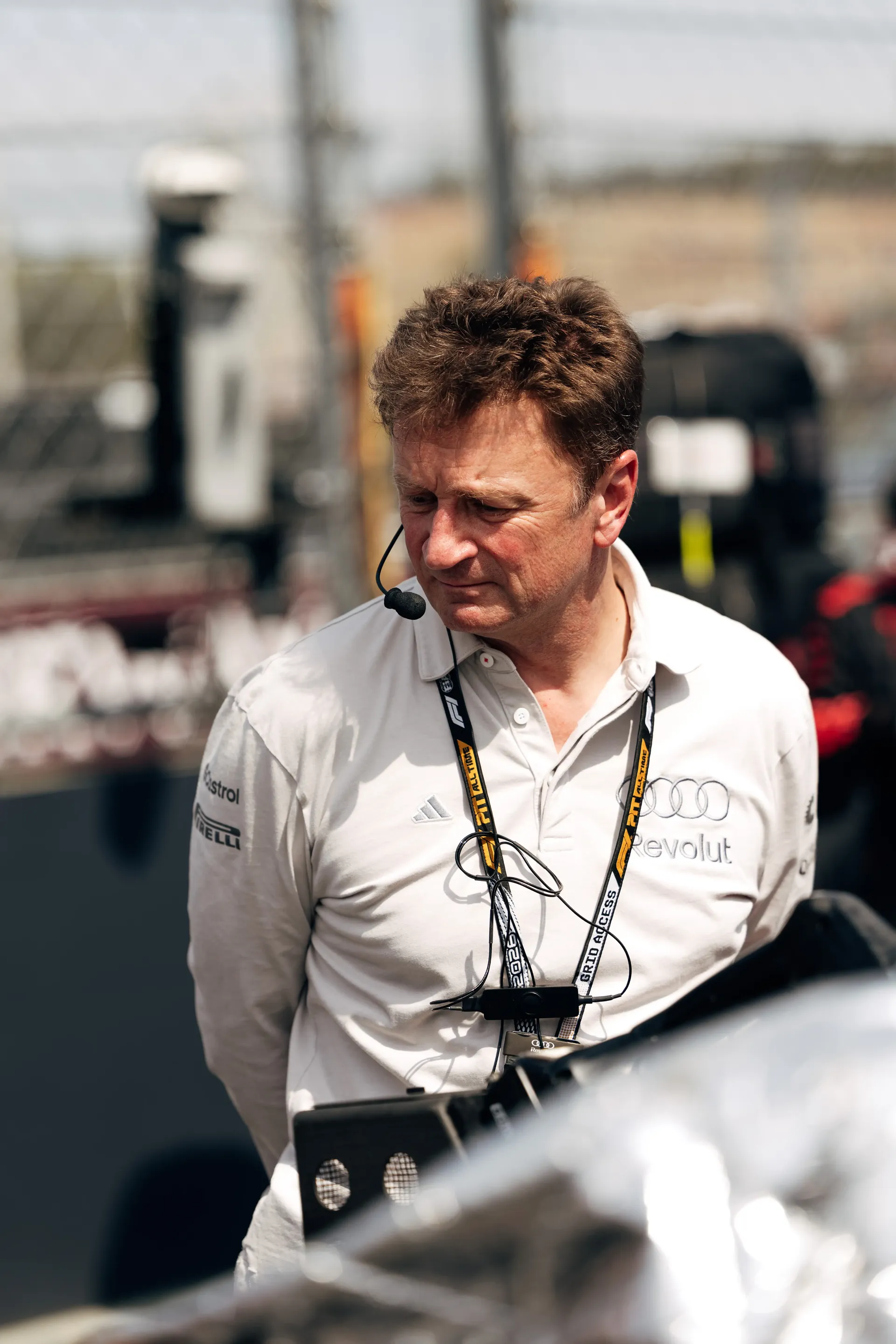 An Audi Revolut F1® Team engineer stands on the Hungaroring grid ahead of the Hungarian Grand Prix.