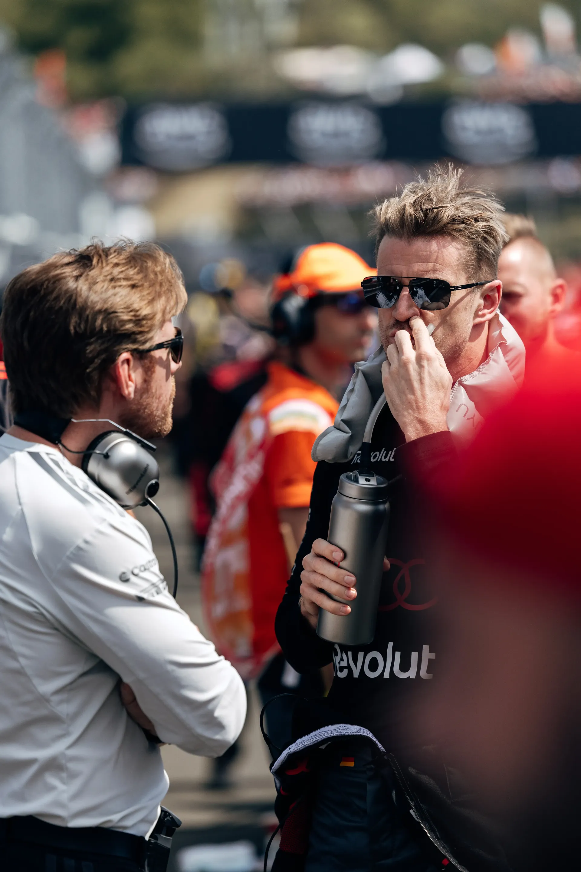 Audi Revolut F1® Team engineers speak with other Formula 1® personnel on the Hungaroring grid before the Hungarian Grand Prix.