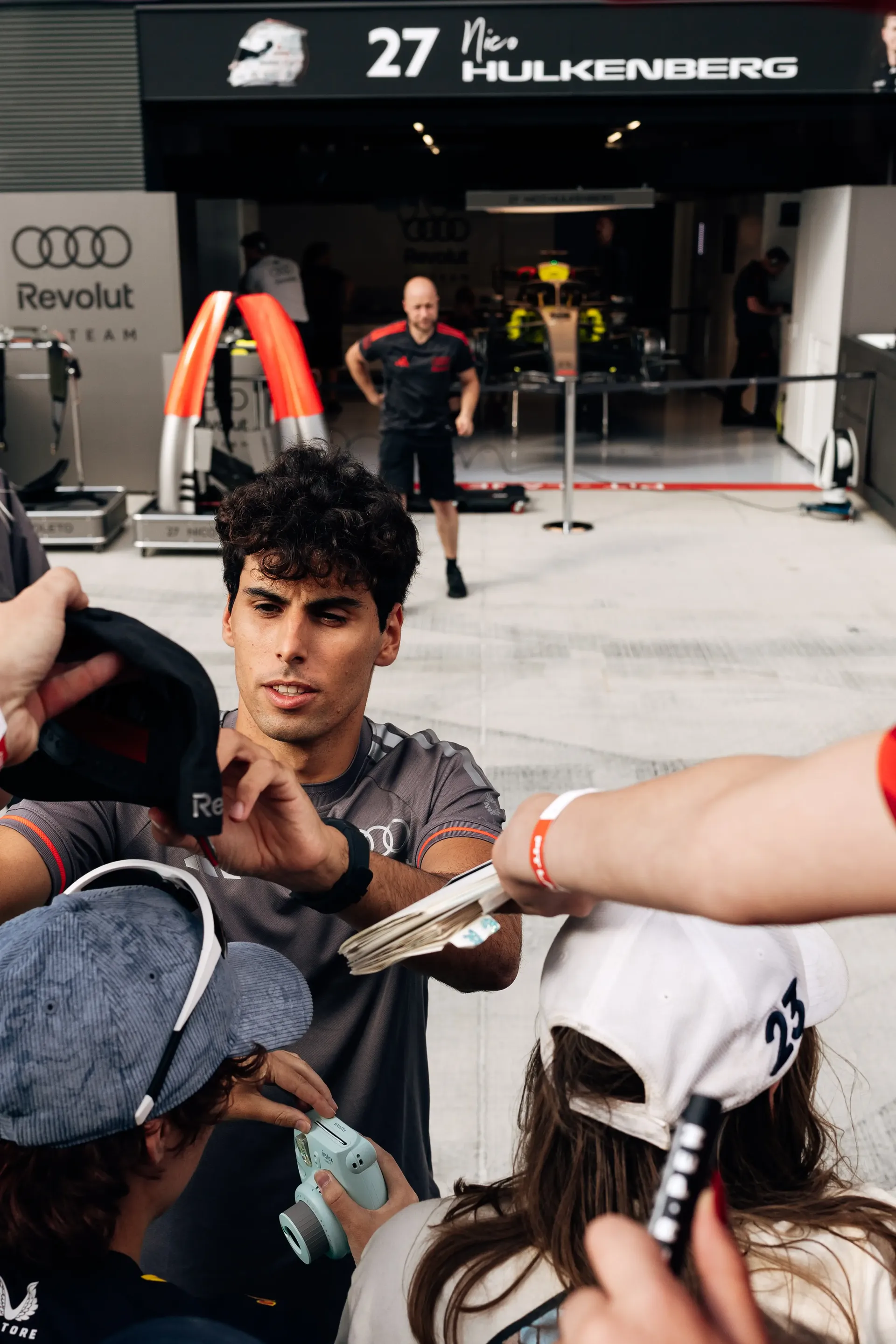 Audi Revolut F1® Team driver Gabriel Bortoleto signs autographs for fans at the Hungaroring ahead of FP1.