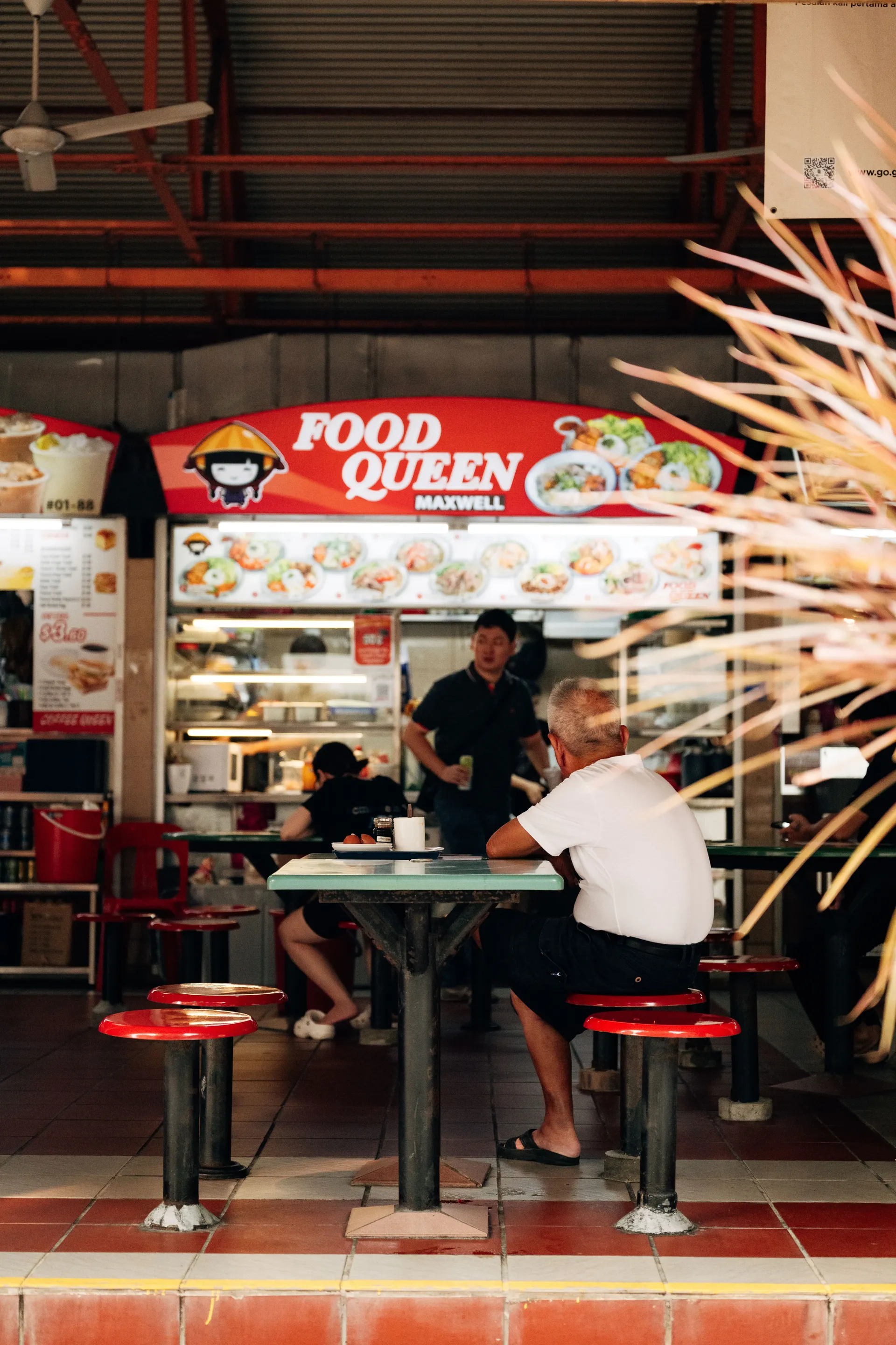 Singapore hawker centre with diners at a food stall