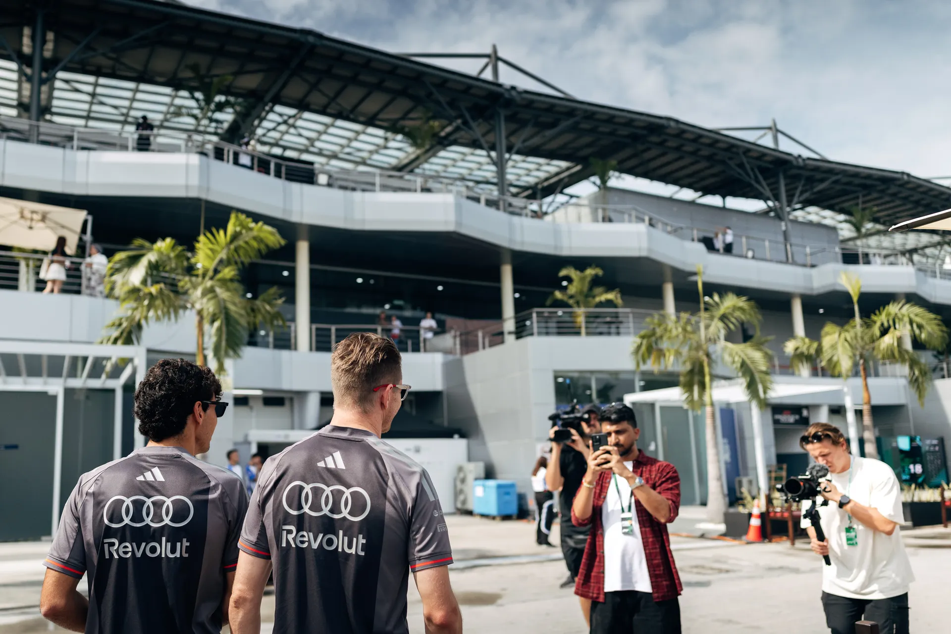 Audi Revolut F1® Team drivers Nico Hulkenberg and Gabriel Bortoleto walking through the Bahrain International Circuit