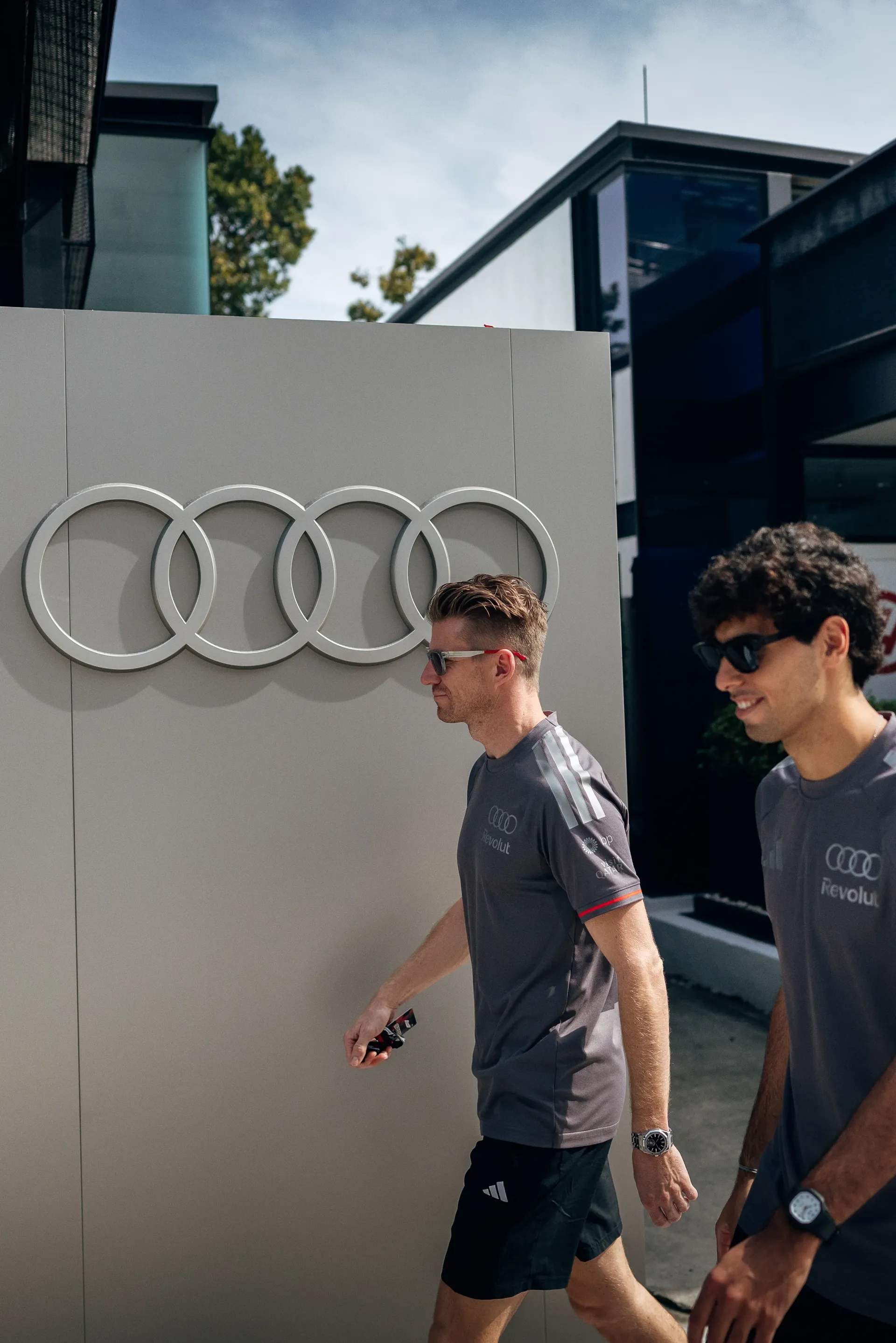 Audi Revolut F1® Team drivers Nico Hulkenberg and Gabriel Bortoleto arriving at the paddock