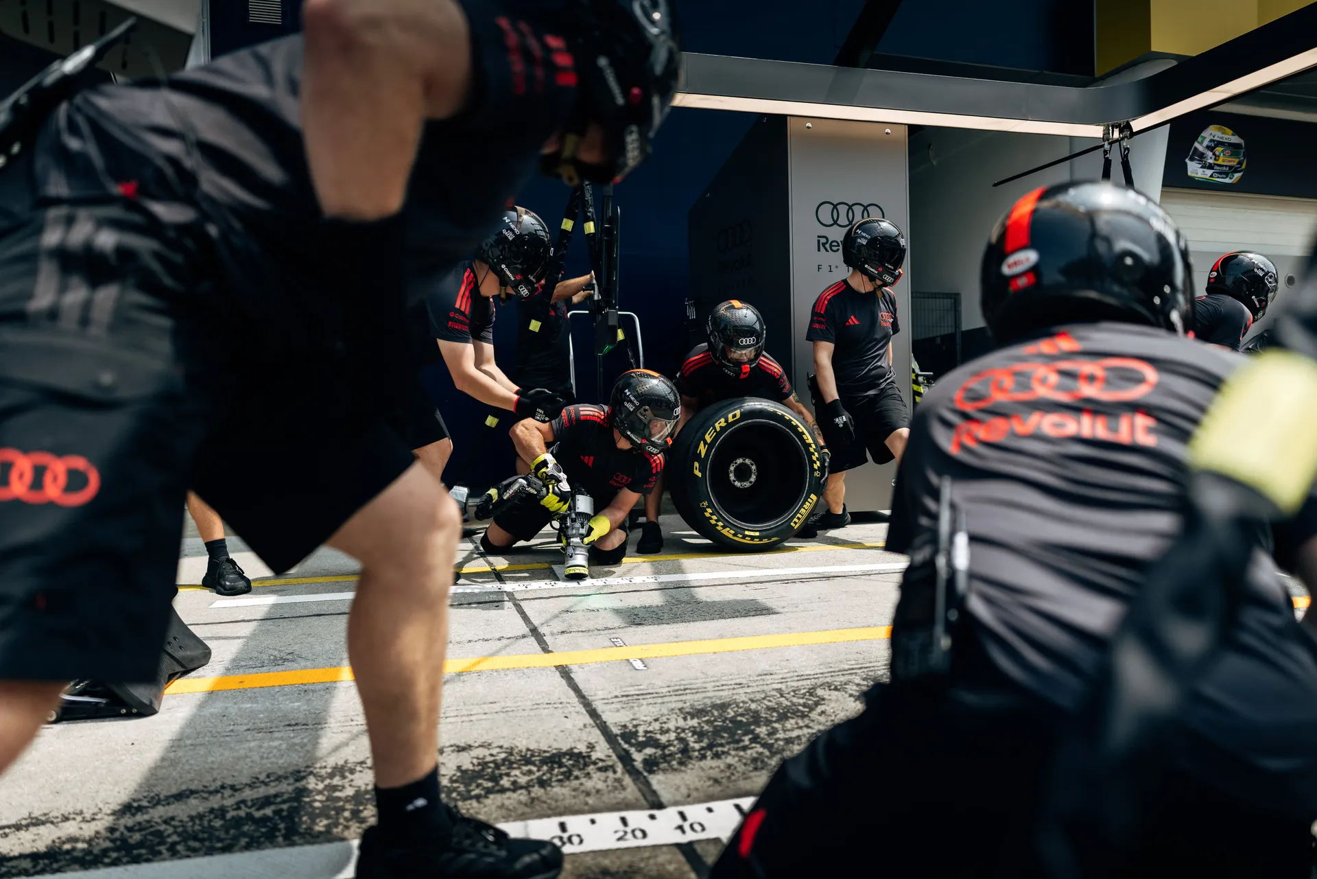 Audi Revolut F1® Team mechanics working on the Audi R26