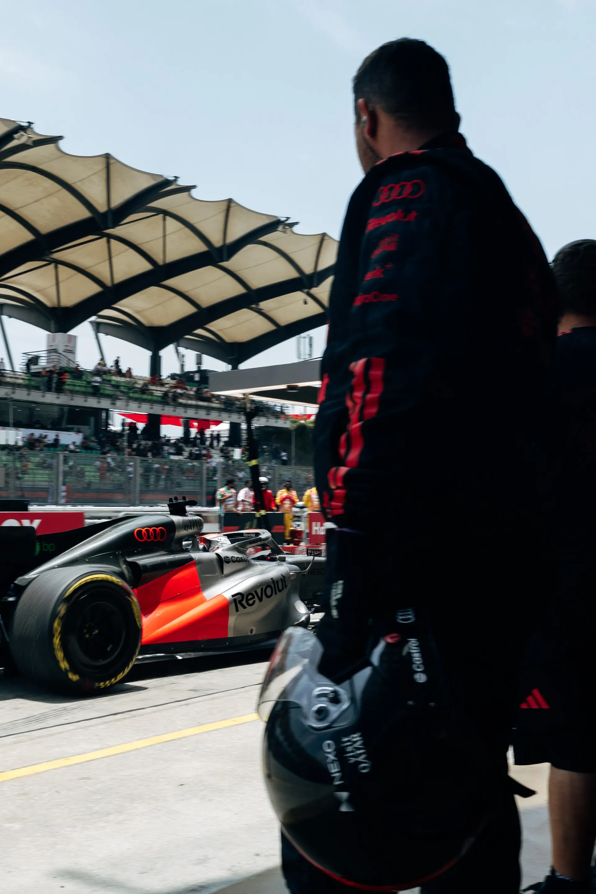 Audi Revolut F1® Team mechanic in the pit lane
