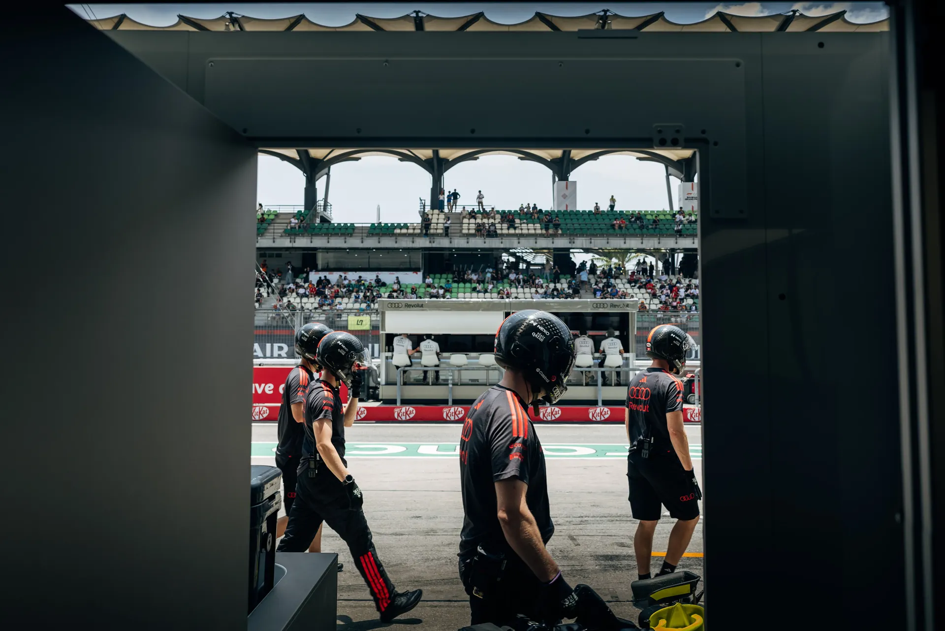 Audi Revolut F1® Team crew in the pit lane