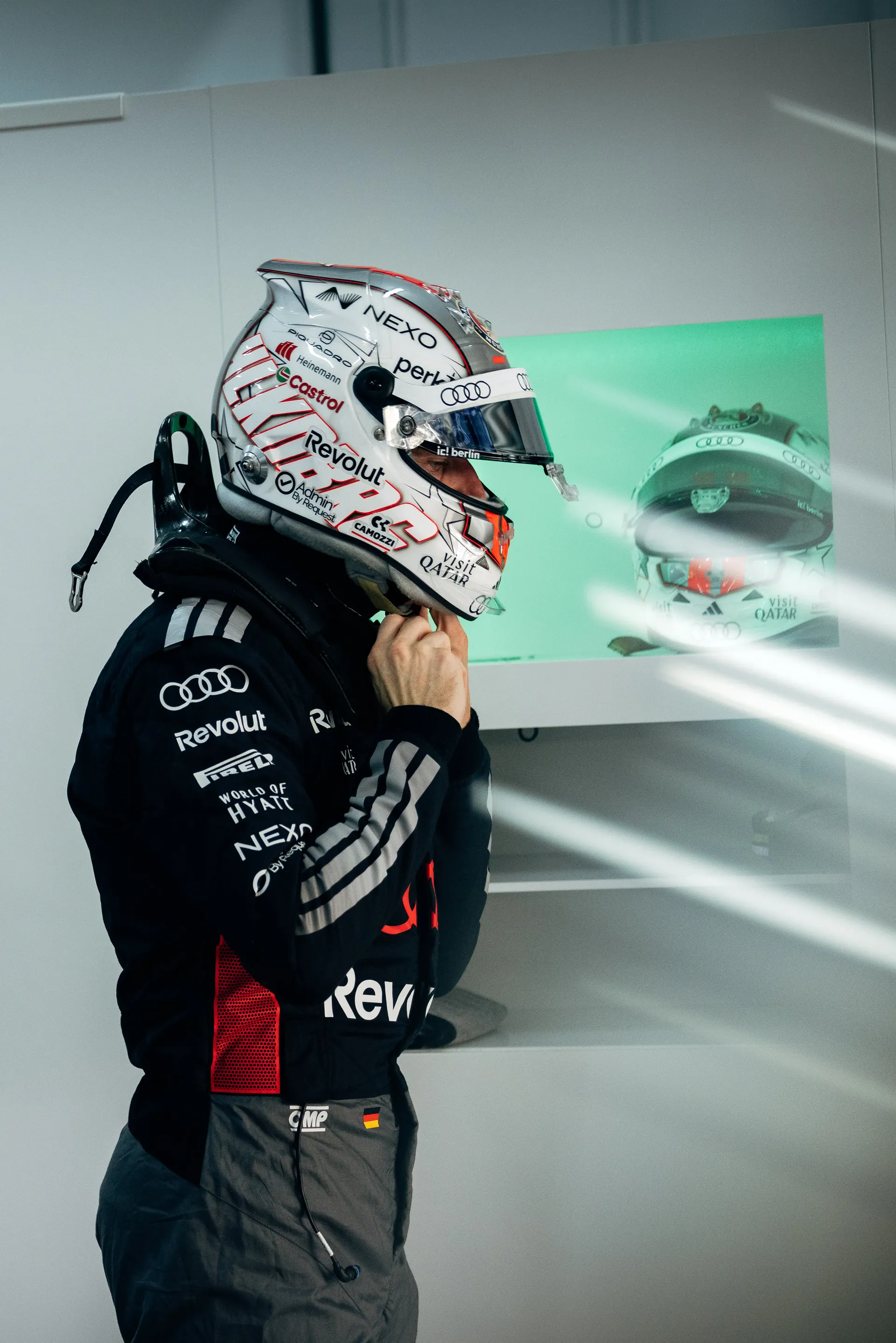 Nico Hulkenberg driver at Audi Revolut F1® Team fixing his helmet ahead of fp2