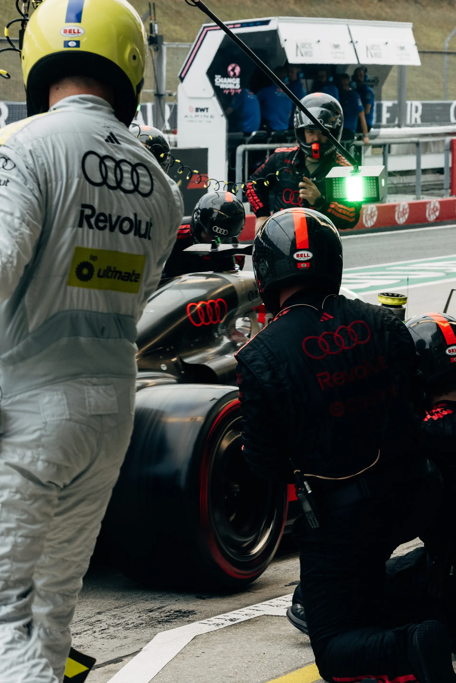 Audi Revolut F1® Team mechanics preparing the car in the pit lane