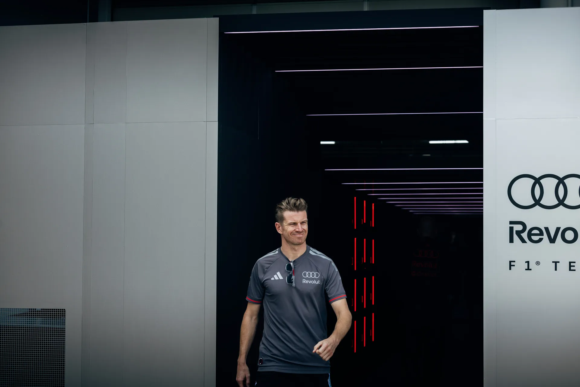 Audi Revolut F1® Team driver Nico Hulkenberg walking in the team garage