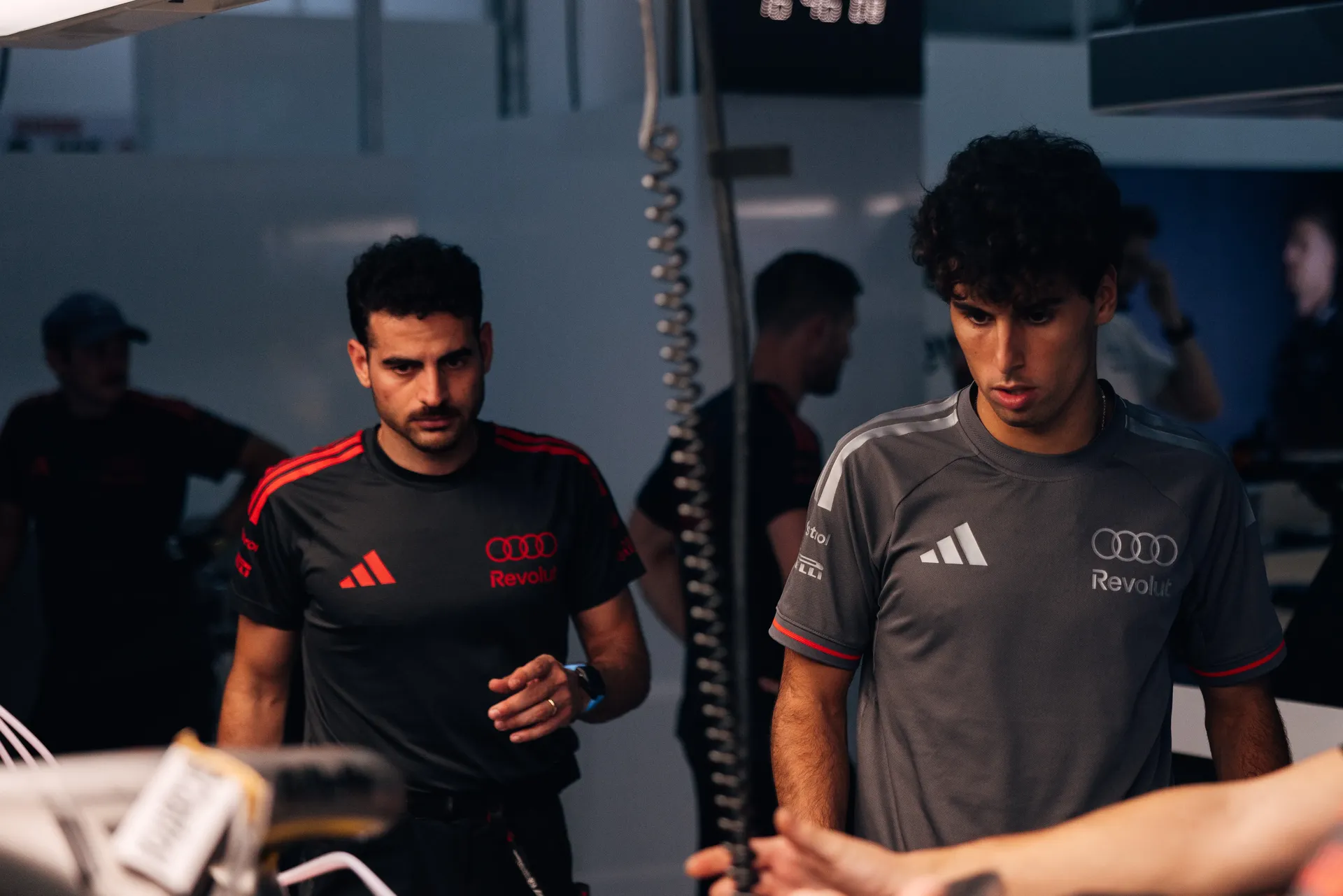 Audi Revolut F1® Team driver Gabriel Bortoleto walking through the garage during a seat check