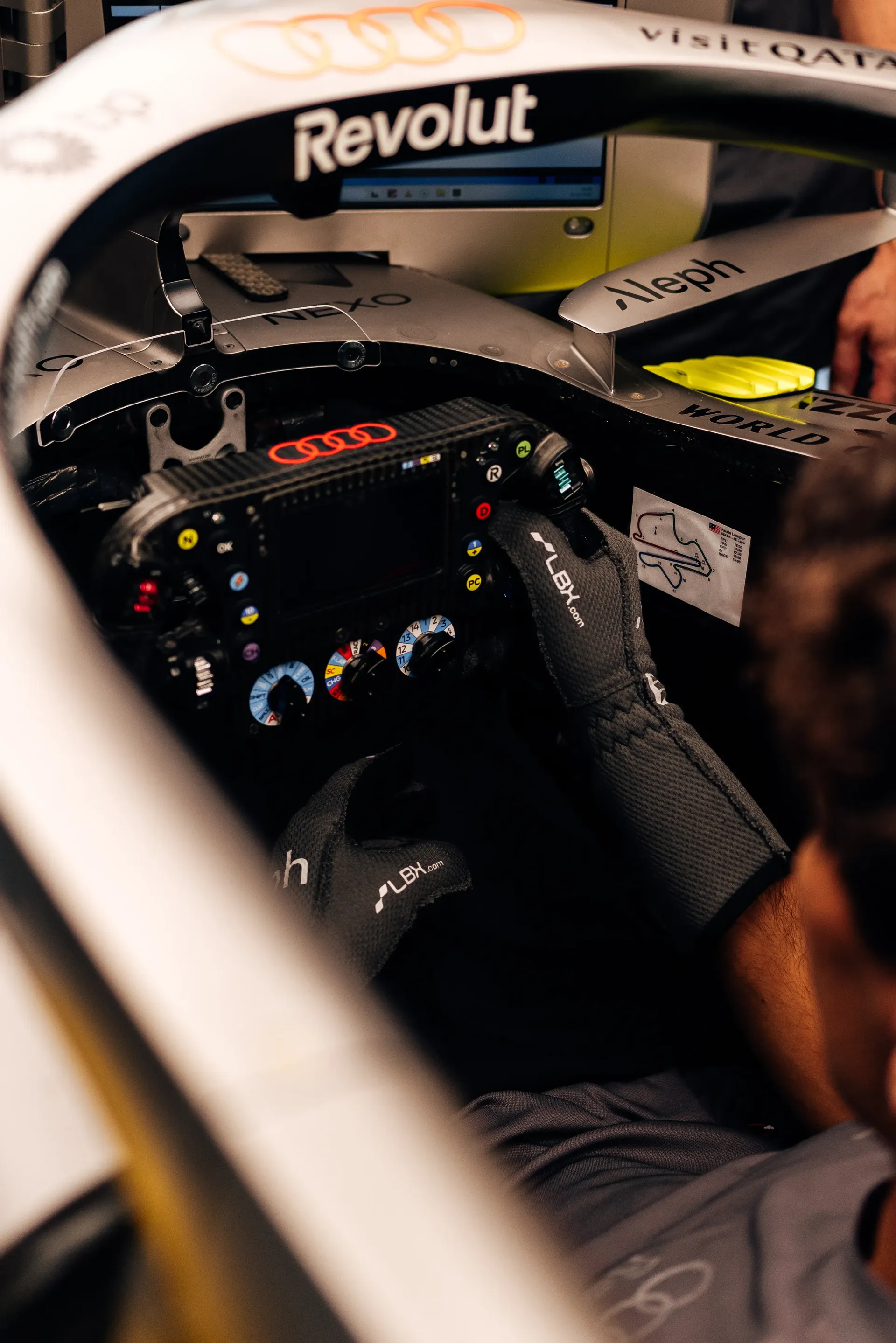 Audi Revolut F1® Team driver Gabriel Bortoleto inside the Audi R26 cockpit during a seat check