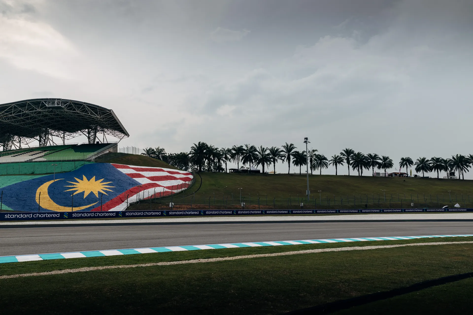 Bahrain International Circuit track with Bahrain flag and palm trees