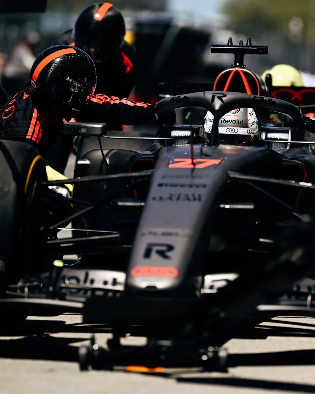 The Audi Revolut F1® Team car R26 at the pitstop surrounded by crew and mechanics at the Canadian Grand Prix on Day one FP1
