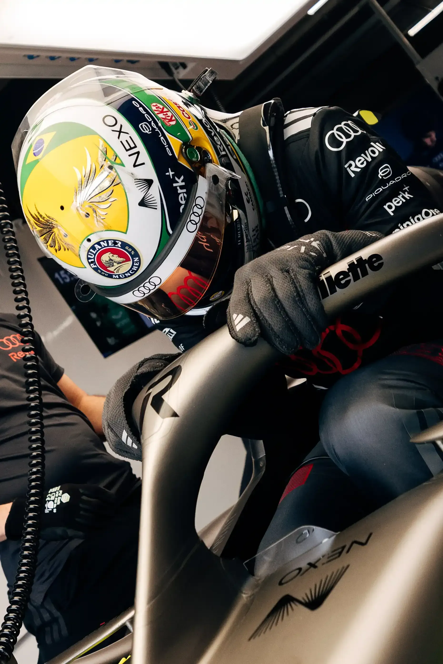 Gabriel Bortoleto driver at the Audi Revolut F1® Team jumps out the cockpit of the R26 car inside the garage at the Canada Grand Prix 2026