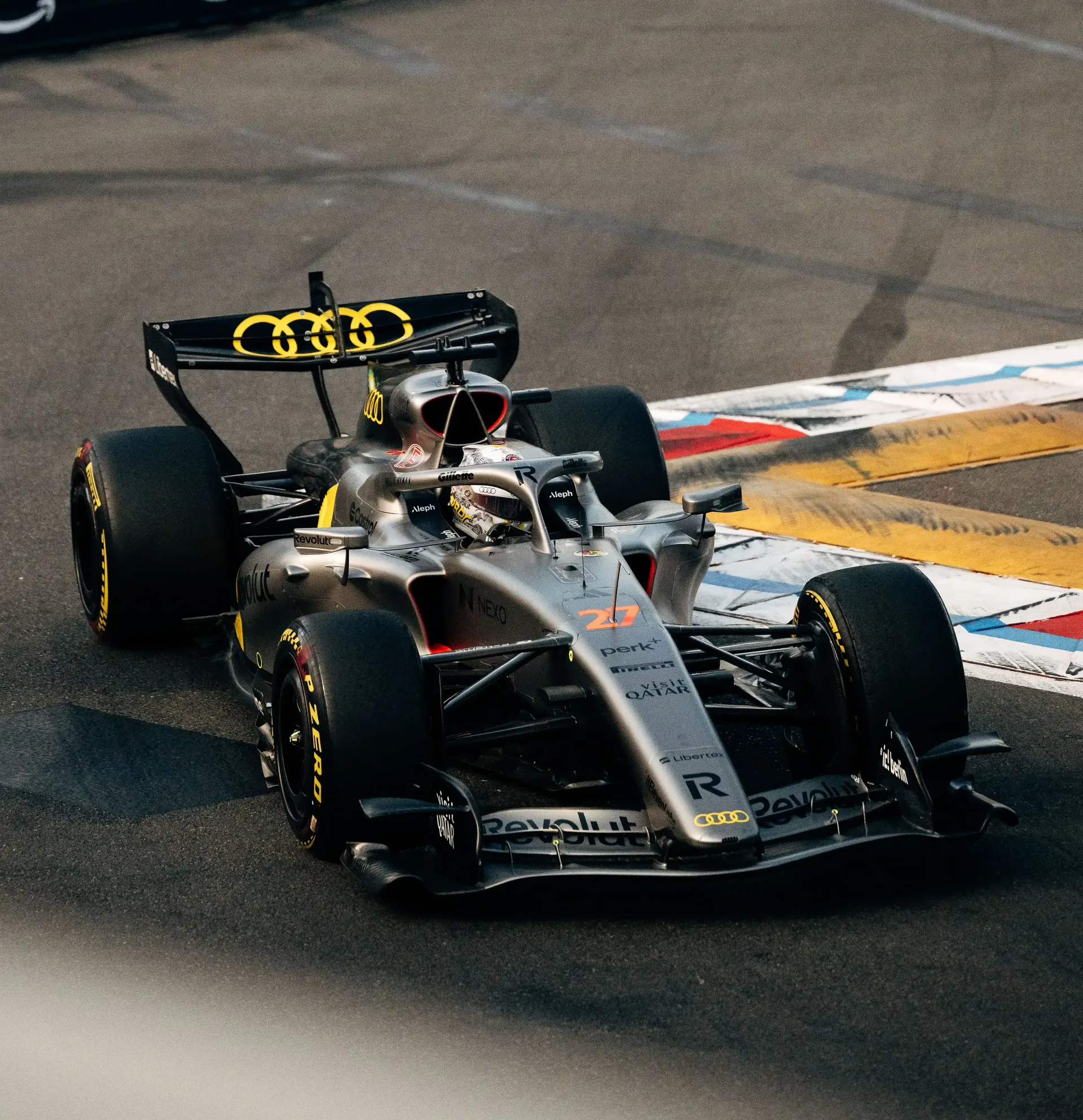 Audi Revolut F1® Team Formula 1 car turning through a Monaco street circuit corner.