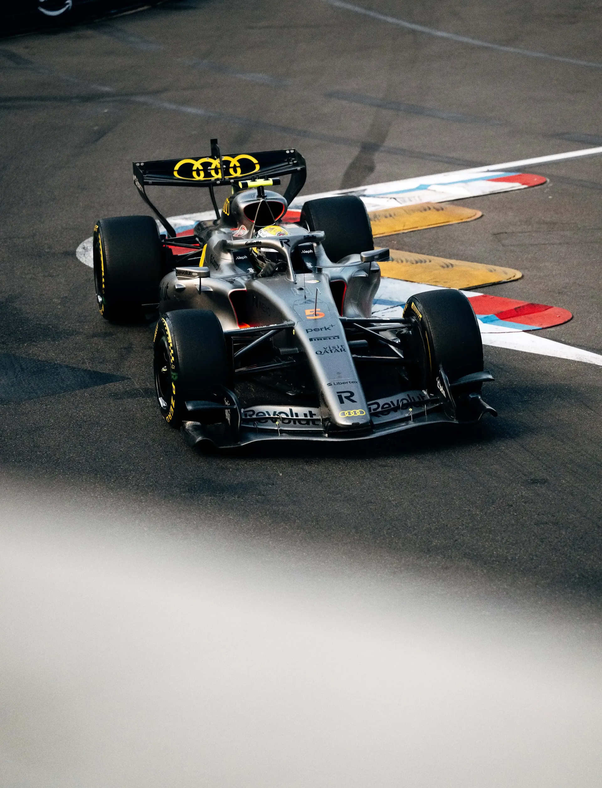 Elevated view of the Audi Revolut F1® Team Formula 1 car approaching a corner on the Monaco circuit.