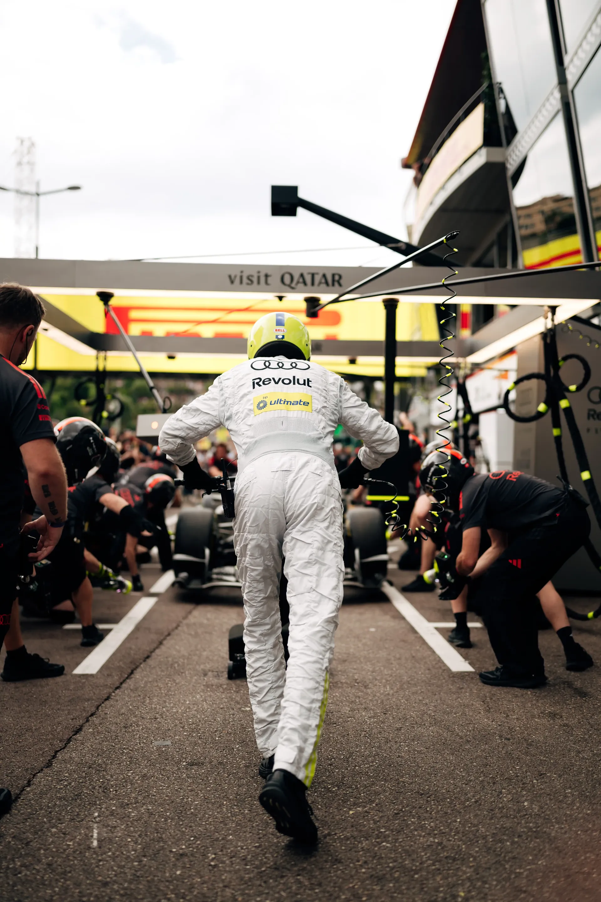 Back shot of Audi Revolut F1® Team engineer surrounded by pitstop crew at the pistop during the Monaco Grand Prix 2026