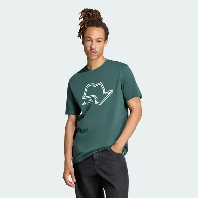 Model in a green T-shirt with a white outline graphic, adidas x Audi Revolut F1® Team Sampa Soul collection