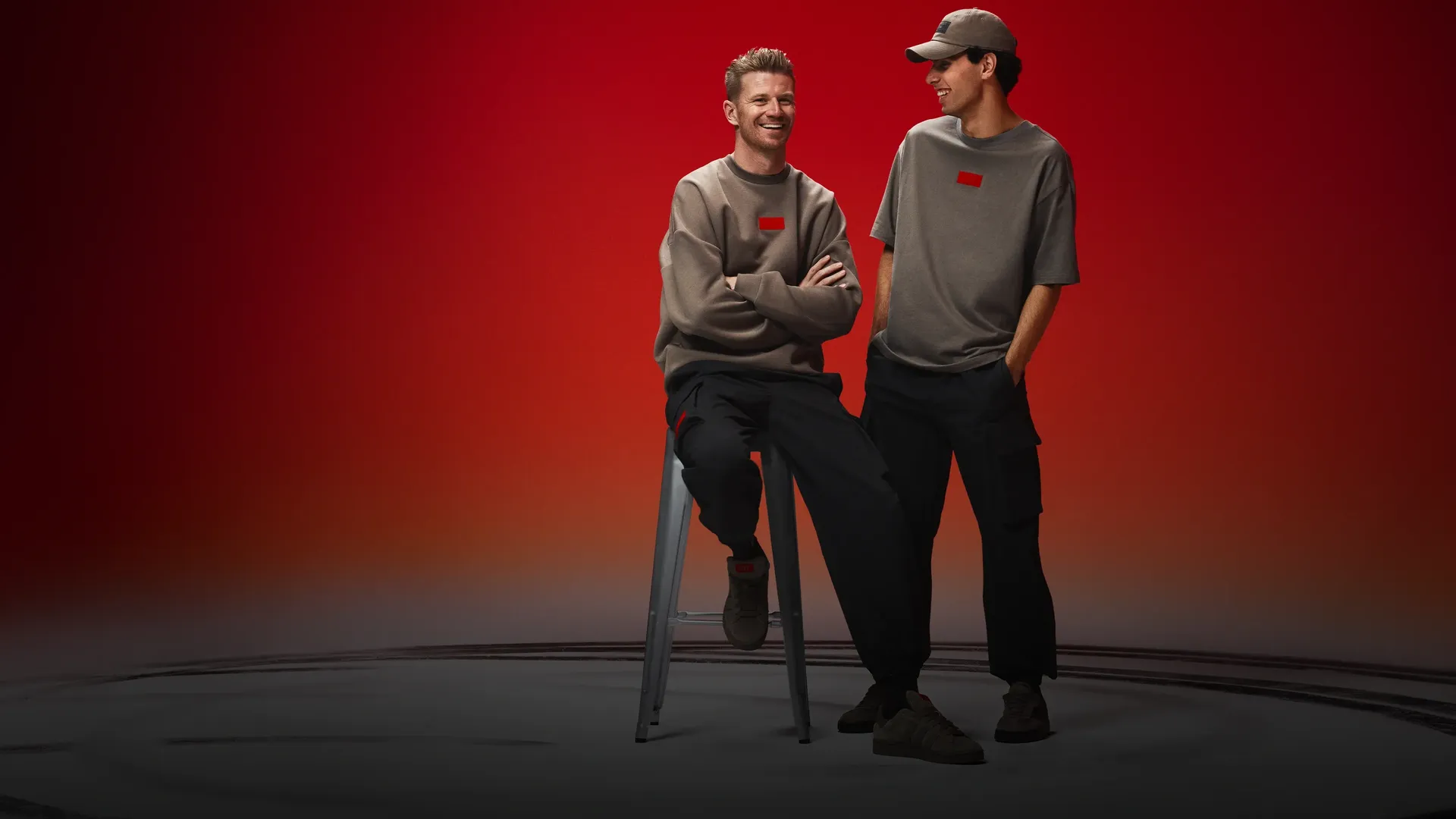 Nico Hulkenberg and Gabriel Bortoleto wearing adidas x Audi Revolut F1® Team Fanwear collection in the studio
