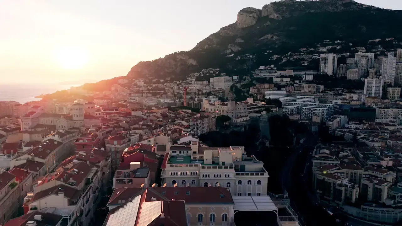 Fly over Monaco harbour at sundown