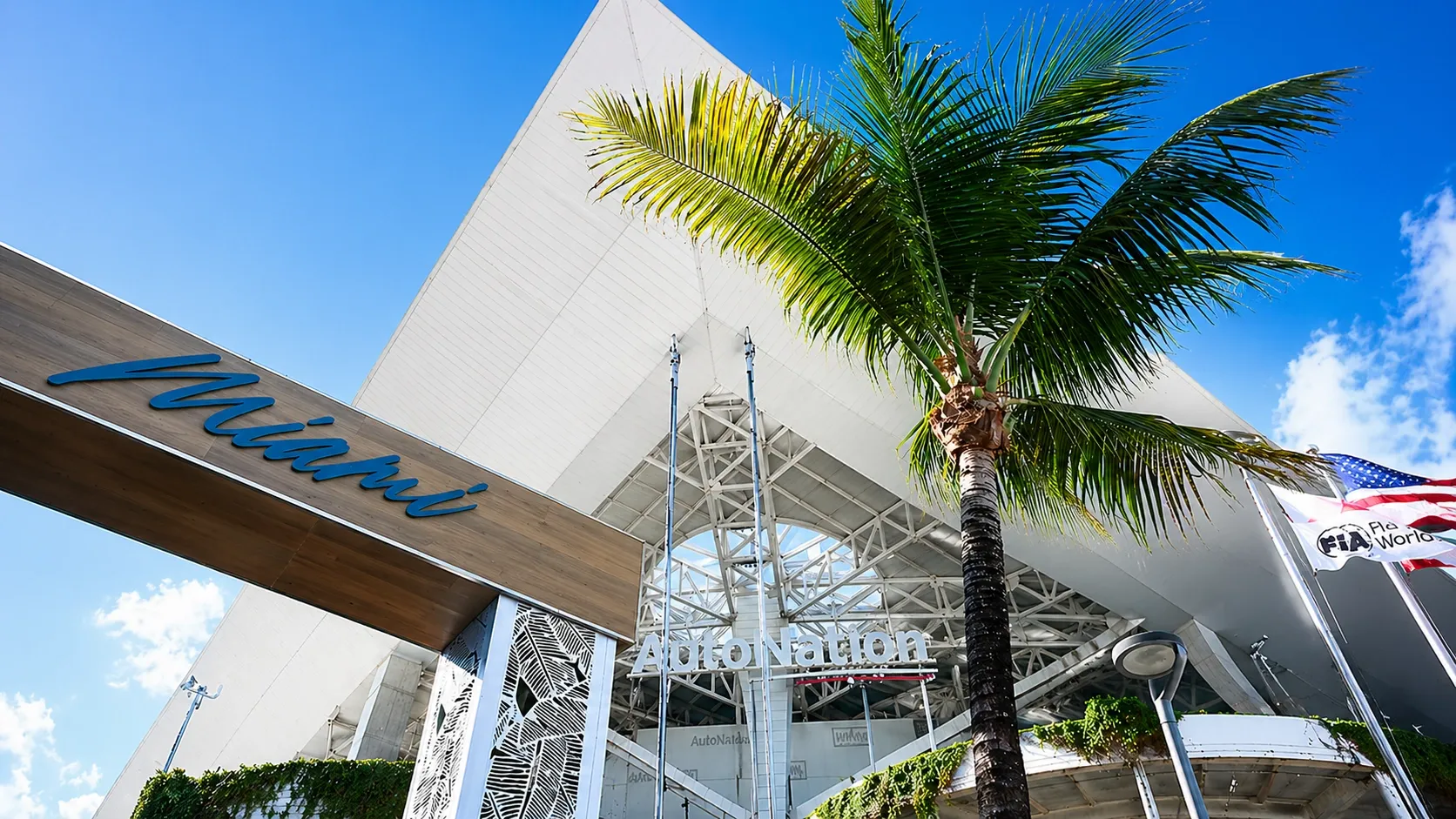 Tall palm tree perspective shot in front of the Auto Nation Building in Miami during the Grand Prix Week 2026
